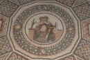 Gulvmosaikker i La Villa Romana del Casale i Piazza Armerina. Her en lidt vovet mosaik fra sovegemakkerne, et siddende samleje.  